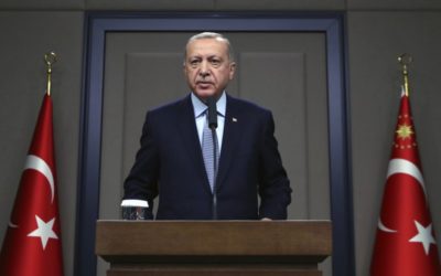Turkish President Recep Tayyip Erdogan talks to reporters before traveling to Russia to meet with Russian President Vladimir Putin, in Ankara, Tuesday, Oct. 22, 2019.