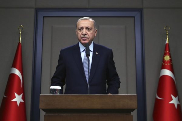 Turkish President Recep Tayyip Erdogan talks to reporters before traveling to Russia to meet with Russian President Vladimir Putin, in Ankara, Tuesday, Oct. 22, 2019.