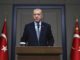 Turkish President Recep Tayyip Erdogan talks to reporters before traveling to Russia to meet with Russian President Vladimir Putin, in Ankara, Tuesday, Oct. 22, 2019.