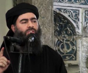 This file image made from video posted on a terror website Saturday, July 5, 2014, purports to show the leader of the Islamic State group, Abu Bakr al-Baghdadi, delivering a sermon at a mosque in Iraq during his first public appearance.