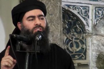 This file image made from video posted on a terror website Saturday, July 5, 2014, purports to show the leader of the Islamic State group, Abu Bakr al-Baghdadi, delivering a sermon at a mosque in Iraq during his first public appearance.