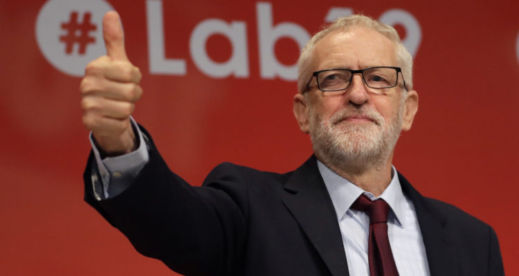Corbyn back in Labour party after disciplinary panel vote