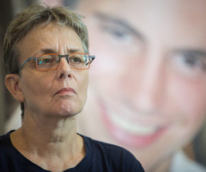 Leah Goldin, with a photo of Hadar in the background.