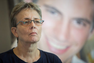 Leah Goldin, with a photo of Hadar in the background.