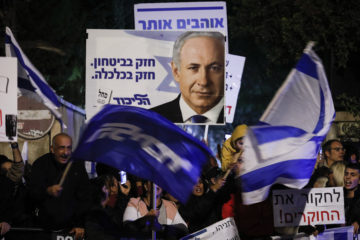 Supporters of Israeli Prime Minister Benjamin Netanyahu demonstrate outside the PM's residence in Jerusalem, November 23, 2019.