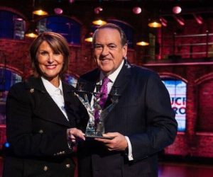 Laurie Cordoza-Moore, president of Proclaiming Justice to the Nations, with former Arkansas Gov. Mike Huckabee.