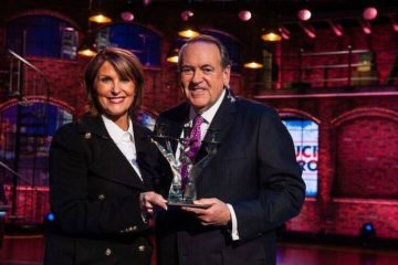 Laurie Cordoza-Moore, president of Proclaiming Justice to the Nations, with former Arkansas Gov. Mike Huckabee.
