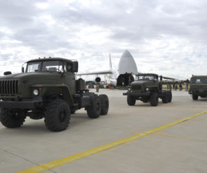 Military vehicles and equipment, parts of the S-400 air defense systems, are seen on the tarmac, after they were unloaded from a Russian transport aircraft, at Murted military airport in Ankara, Turkey, Friday, July 12, 2019.