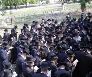 Members of the Satmar Hasidic Community from New York pray at the grave of Rabbi Moshe Teitelbaum, the founder of the community, in the old Jewish cemetery of Satoraljaujhely, 256 kms northeast of Budapest, Hungary, July 15, 2015.