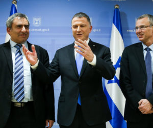 Speaker of the Israeli parliament Yuli Edelstein flanked by Likud party negotiators at the Knesset in Jerusalem on November 27, 2019