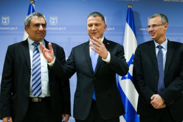 Speaker of the Israeli parliament Yuli Edelstein flanked by Likud party negotiators at the Knesset in Jerusalem on November 27, 2019
