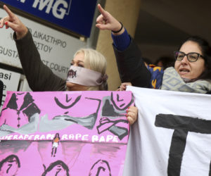 Protesters stage a demonstration outside a court house in Paralimni, Cyprus on Monday, December 30, 2019, in support of a 19 year-old British woman who was found guilty of fabricating claims that she was gang raped by 12 Israelis.