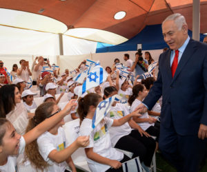 Prime Minister Benjamin Netanyahu greets children on the first day of school, September 1, 2017.