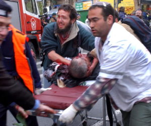 Medics rush a man wounded