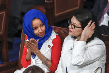 Rep. Ilhan Omar, D-Minn., left, joined at right by Rep. Rashida Tlaib, D-Mich
