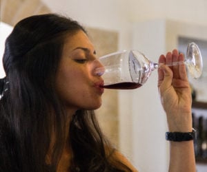 A woman sips from her glass of wine in the Psagot winery, north of Jerusalem.