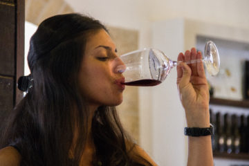 A woman sips from her glass of wine in the Psagot winery, north of Jerusalem.