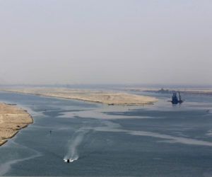 In this Aug. 6, 2015 file photo, an army zodiac secures the entrance of the new section of the Suez Canal in Ismailia, Egypt.
