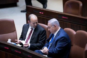 Prime Minister Benjamin Netanyahu, right, conferring with Defense Minister Naftali Bennett.