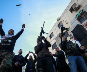 Fatah terrorists hold up their weapons during a rally, in Ramallah, December 31, 2019, marking the 55th anniversary of Fatah's first attack against Israel. (