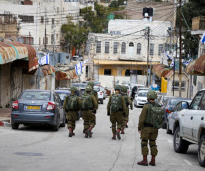 Israeli soldiers patrol in the city of Hebron, December 30, 2019.