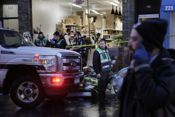 In this Dec. 11, 2019 photo, emergency responders work at a kosher supermarket, the site of a shooting in Jersey City, N.J.