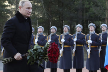 President Vladimir Putin attends a wreath laying commemoration ceremony for the 77th anniversary since the Leningrad siege was lifted during the World War Two, at the Boundary Stone monument, about 50 kilometers east of St.Petersburg, Russia, Saturday, Jan. 18, 2020.