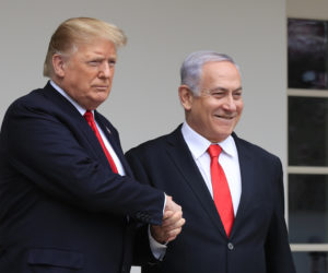 In this March 25, 2019 photo, President Donald Trump welcomes visiting Israeli Prime Minister Benjamin Netanyahu to the White House in Washington.