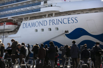 Media gather outside the quarantined Diamond Princess cruise ship in Yokohama, near Tokyo, Tuesday, Feb. 11, 2020.