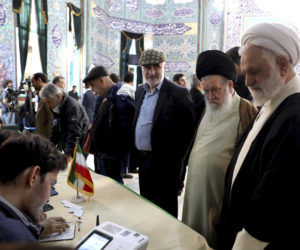 Voters register to cast their vote in Iran
