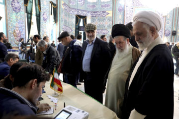 Voters register to cast their vote in Iran