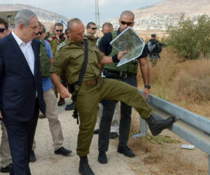 Israeli Prime Minister Benjamin Netanyahu (L) on a visit to Judea and Samaria