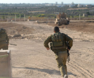 Israeli soldiers guard a school gate