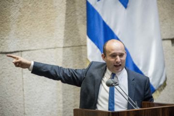 Defense Minister Naftali Bennett speaks in the Knesset, the Israeli parliament in Jerusalem.