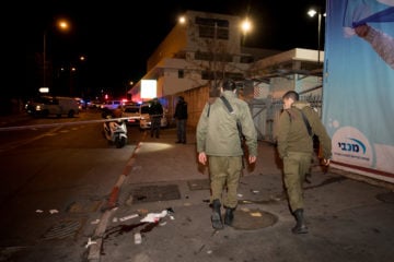 Israeli soldiers at the scene of a car ramming attack near the First Station entertainment center in Jerusalem, on February 6, 2020.