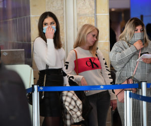 People wear face masks at Ben Gurion International Airport following reports about the deadly coronavirus, which originated in China, having spread worldwide, February 2, 2020.