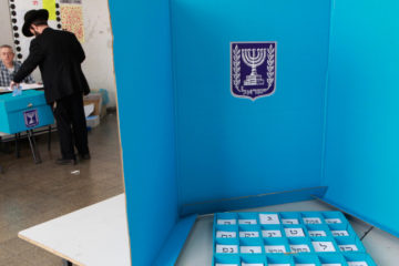 ultra orthodox man votes in Beitar Illit settlement