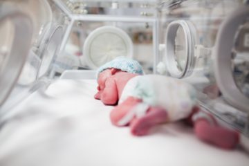 illustrative baby in incubator