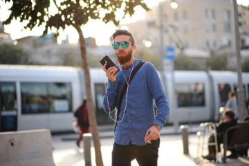 young Israeli man speaking on his phone