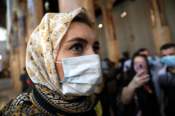 Tourists wearing face masks