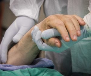 Doctor holding patients hand