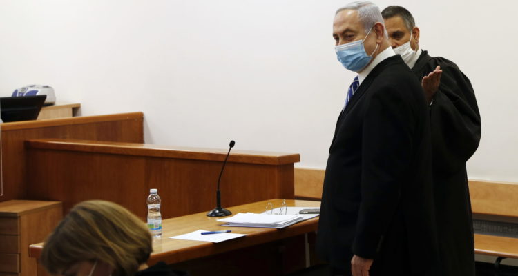 Netanyahu trial kicks off as PM avoids bad optics, defense asks for more time