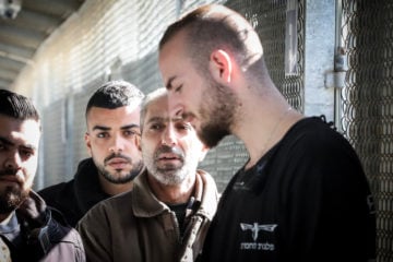 Samar Arbid (in brown) is brought to the courtroom for his trial at the Israel's Ofer military court near Ramallah on February 17, 2020. Arbid is accused of masterminding the terrorist attack which killed 17-year-old Israeli girl Rina Shnerb. (Flash90)