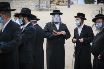 ultra-orthodox men pray