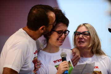 Shira Vishniak, sister of Maya Vishniak who was murdered by her partner, speaks during an anti-domestic violence protest in Tel Aviv, on June 1, 2020. (Flash90/Tomer Neuberg)