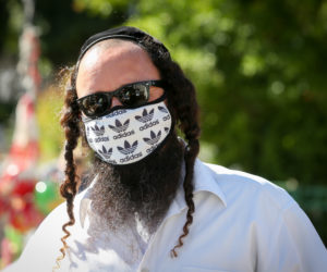 Israelis wear protective face masks