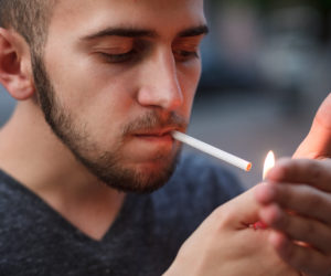 young man smokes