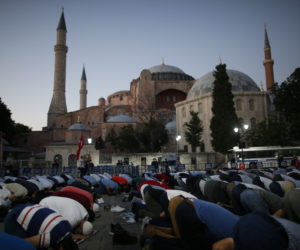 Muslims pray outside of the Hagia Sophia on Friday, July 10, 2020, following the decision that the UNESCO World Heritage site will revert to a mosque. (AP Photo/Emrah Gurel)