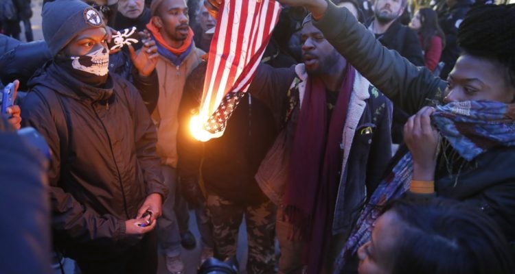 Shots fired as crowds clash with police in downtown Chicago