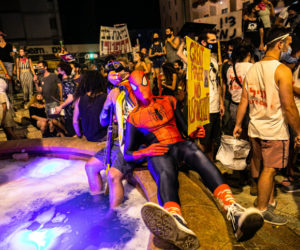 Israeli dressed as Spiderman at an anti-government protest in Jerusalem